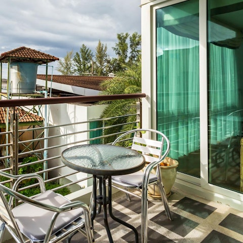 Enjoy a cool drink on your private balcony