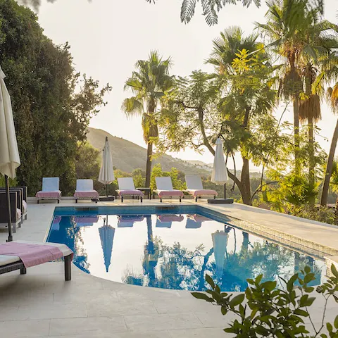 Feel a wonderful sense of wellbeing while relaxing by the pool