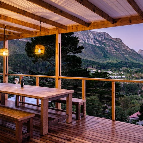 Enjoy sunset drinks on the balcony overlooking the mountain