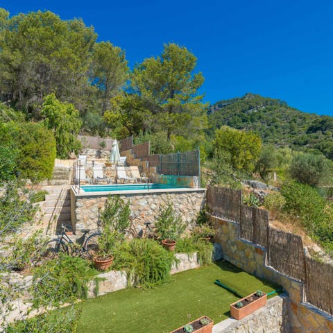 Explore the pretty, terraced garden to the rear