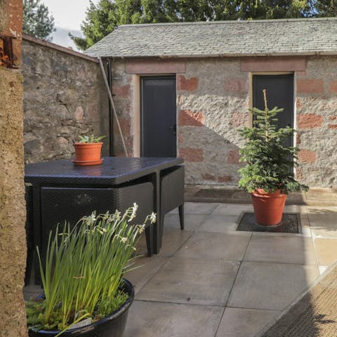 Enjoy your whisky sour in the walled courtyard