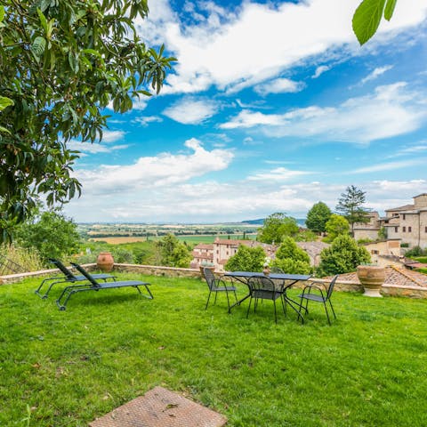 Take in the stunning views over the Tuscan landscape from the shared gardens