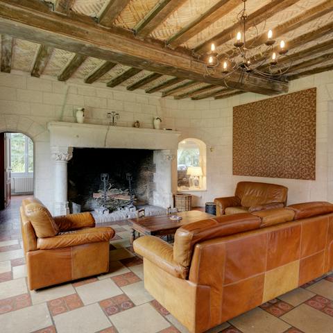 Step back in time, gathered around the huge open hearth in the living room
