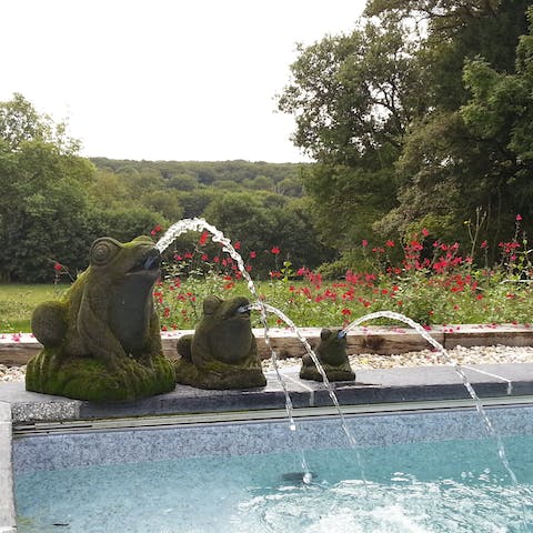 Take a dip in the fountain-fed swimming pool with the forest stretching before you