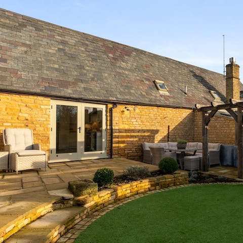 Soak up the sunshine in the cottage's manicured garden