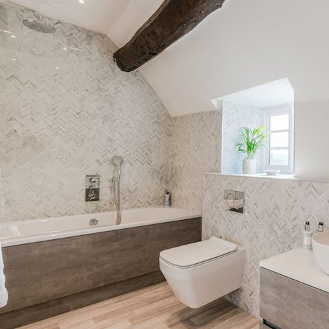 Close your eyes and lie back in the rather svelte bathtub