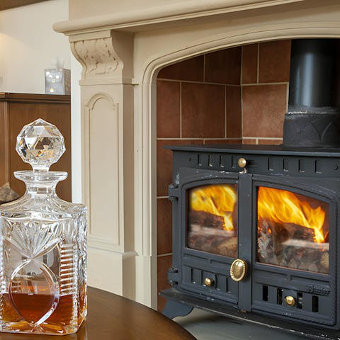 Enjoy a glass of whisky by the log burner