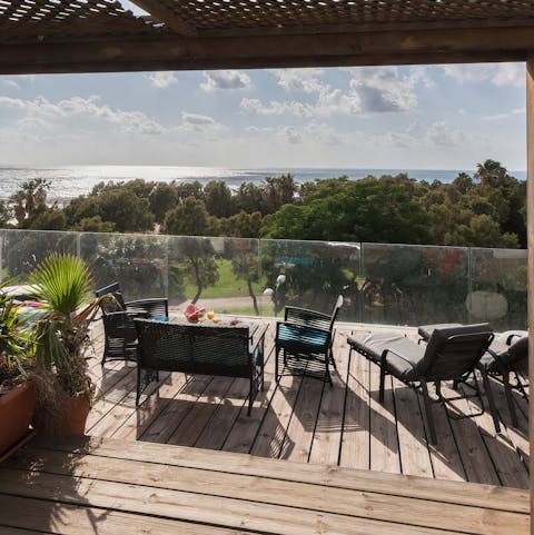 Soak up the Israeli sun from your shared deck terrace overlooking the Mediterranean Sea