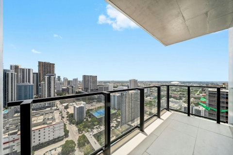 Sip a drink on the private balcony with the Miami skyline as a backdrop
