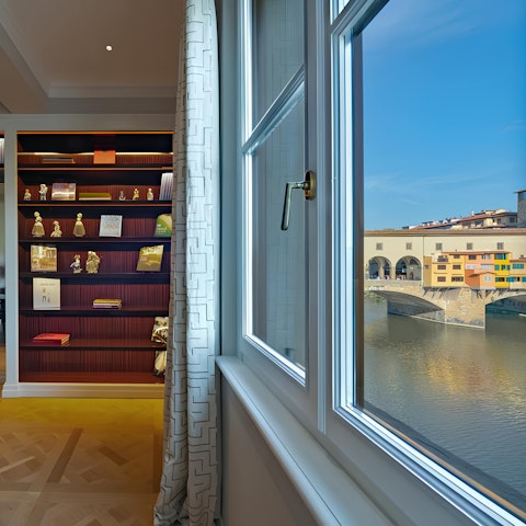 Admire views of the iconic Ponte Vecchio from the living and dining space