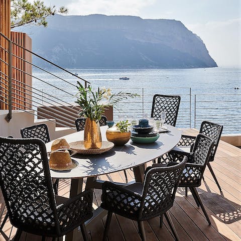 Enjoy a slap-up supper on the terrace as the sun begins to set