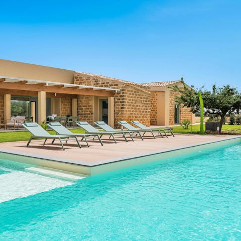 Spend your days sunbathing around the private pool