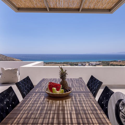 Savour delicious Greek meals as the sun sets over the island