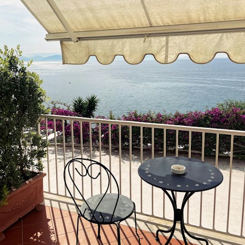 Gaze out over the sea while enjoying a coffee from a local cafe