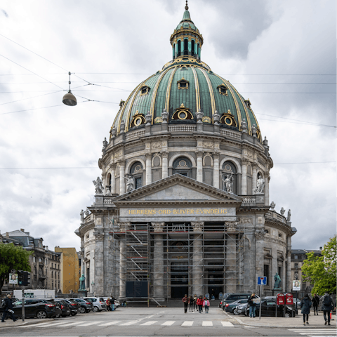 Visit the iconic Amalienborg Palace – it's just a few steps away