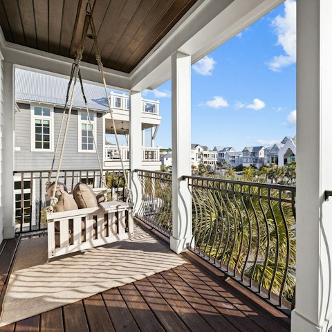 Relax on the balcony swing seat with your morning coffee