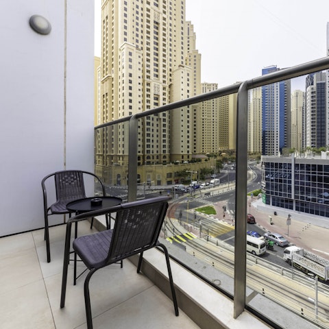 Watch the city come to life from your private balcony on high