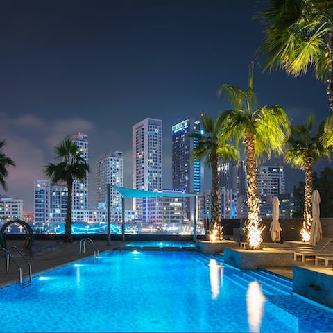 Swim laps in one of two outdoor swimming pools
