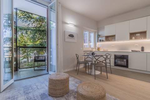 Step onto the balcony as greenery fills the view
