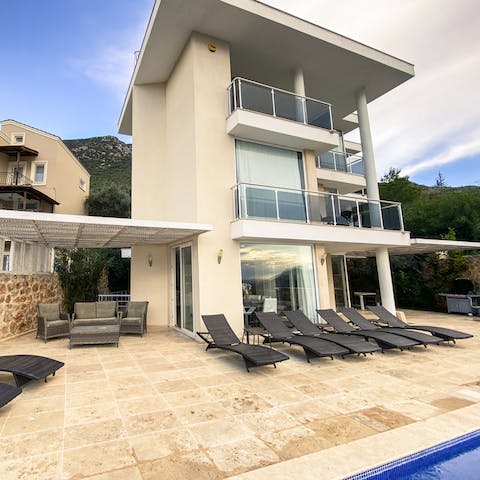 Soak up some vitamin D from the poolside loungers