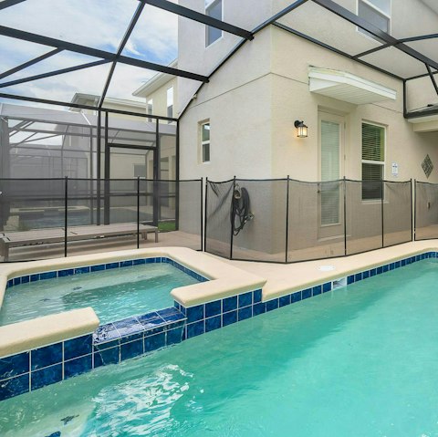Cool off and unwind in the private pool with an in-built hot tub