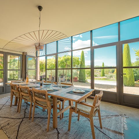 Take breakfast at the sunny dining table overlooking the gardens