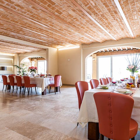 Seat the whole group across two tables in the dining room