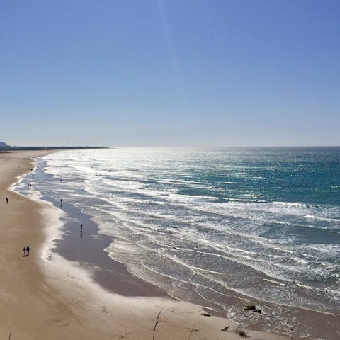 Stroll along the sands of  Spiaggia di Monte Cogoni, 1.5km away
