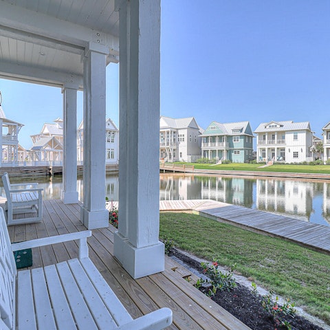 Sip on a glass of something iced as you overlook the water