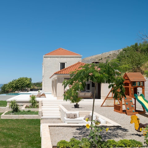 Relax by the pool while the kids make the most of the playground