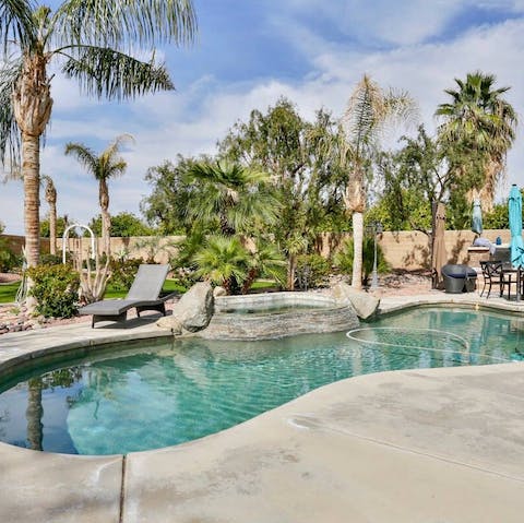Slip into the lagoon shaped pool, surrounded by greenery