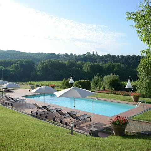 Relax in the sun by the shared swimming pool