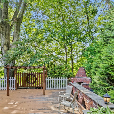 Take a quiet moment on the barbecue terrace beneath the trees