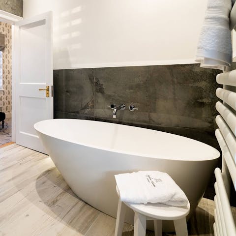 Treat yourself to a bath in any one of the tubs across the two homes