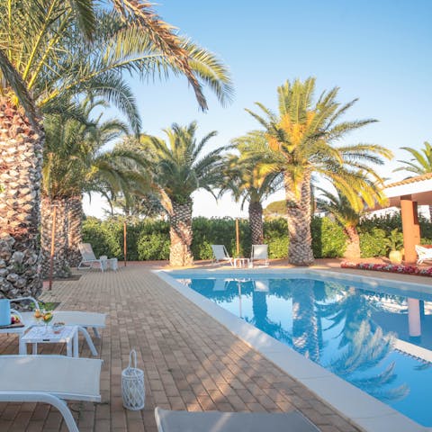 Soak up the sun beside the private pool