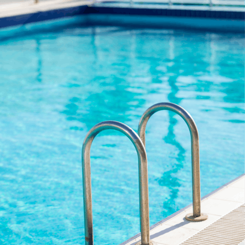 Cool down with a refreshing dip in the communal swimming pool