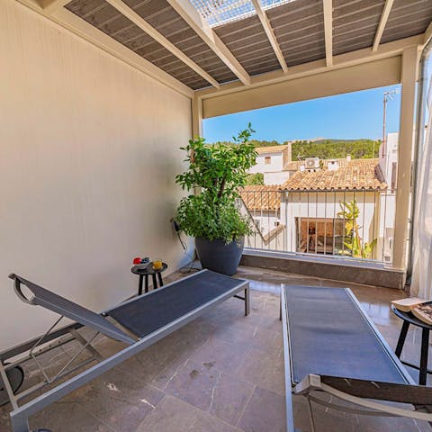 Head up to the shaded first-floor terrace for a view of the mountains