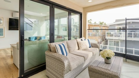 Lounge on the wicker sofa as the coastal breeze rolls in