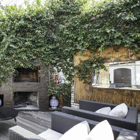 Light the outdoor fireplace and settle down for the evening with a glass of wine