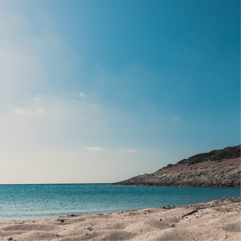 Spend an afternoon basking in the sunshine on Kamari Beach