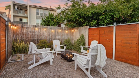 Gather around the firepit with drinks as the sun sets