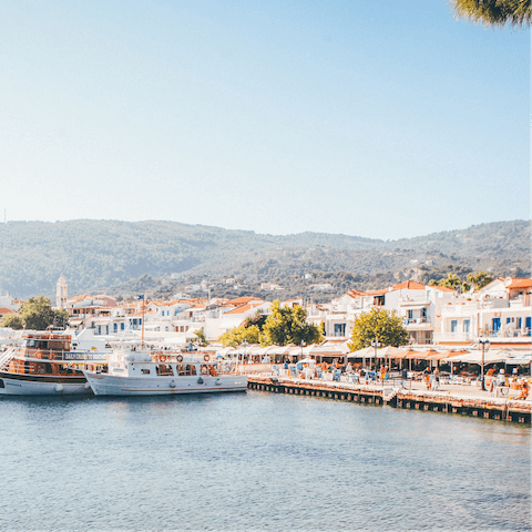 Explore Skiathos town and harbour, a fourteen-minute walk away