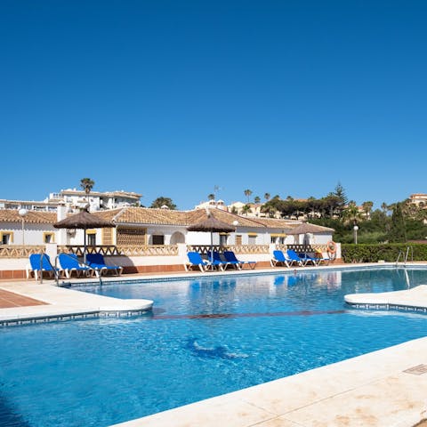 Take a refreshing dip in the communal swimming pool
