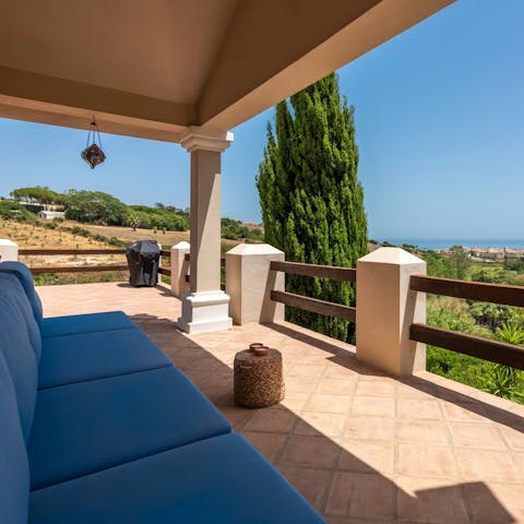 Admire sweeping countryside views and a glimpse of the sea from the balcony