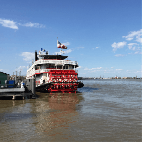 Cruise along the Mississippi River aboard the Steamboat Natchez Riverboat, fifteen minutes away on foot
