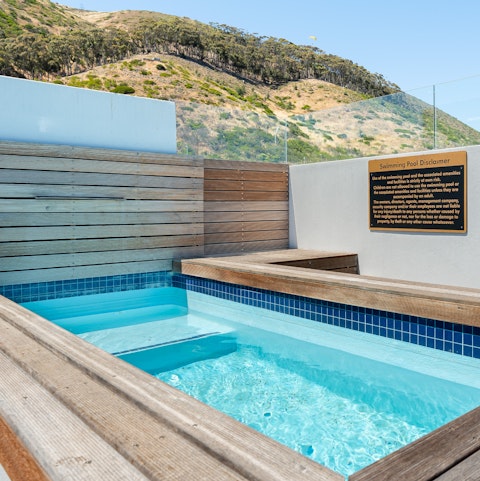 Go for a dip in the clear blue waters of the shared rooftop pool