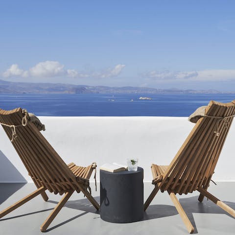 Gaze out over Orkos Bay from the suntrap of a rooftop terrace