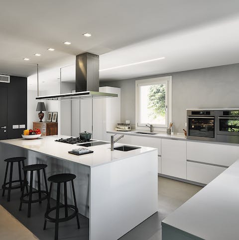 Enjoy the sleek design of the open plan kitchen