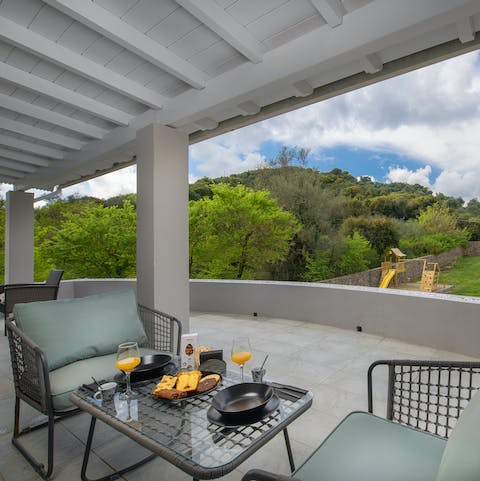 Enjoy your breakfast out on the balcony overlooking the pool