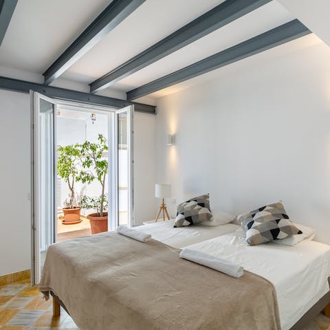 Wake up blissfully in your calm bed before padding out onto the warm tiles